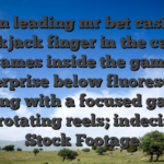 Son leading mr bet casino blackjack finger in the casino slot games inside the gambling enterprise below fluorescent lighting with a focused gaze on the rotating reels; indecision Stock Footage